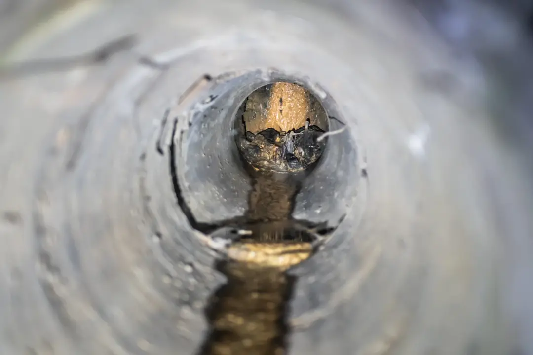 Blockage building up at a joint inside a drain pipe
