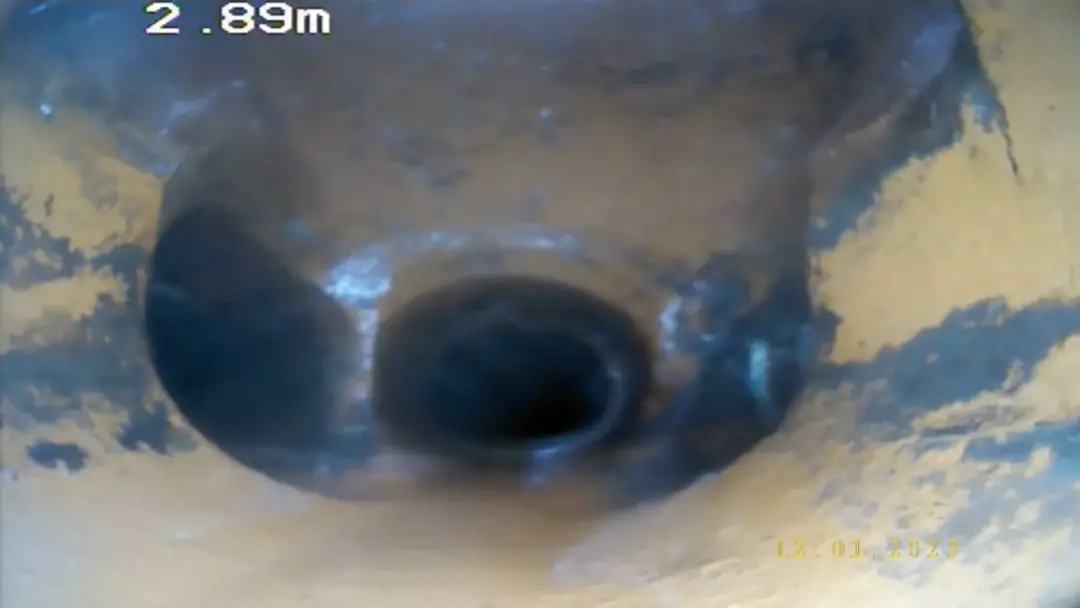 CCTV drain survey view of a displaced pipe joint