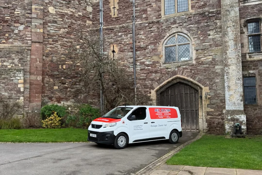 Jet Plumb van parked outside a stone country estate in Gloucestershire